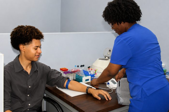 Nurse drawing blood for lab testing